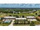 Aerial view of condos with community pool and golf course in the background at 1236 Rio De Janeiro Ave # 406, Punta Gorda, FL 33983