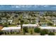 Aerial view of condo building with golf course and lake views at 1236 Rio De Janeiro Ave # 406, Punta Gorda, FL 33983