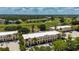 Beautiful aerial view of the condo community, lush landscaping, and golf course at 1236 Rio De Janeiro Ave # 406, Punta Gorda, FL 33983
