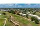 Scenic aerial view of condos near a golf course and winding stream at 1236 Rio De Janeiro Ave # 406, Punta Gorda, FL 33983