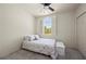 Cozy bedroom featuring a unique window design and comfortable furnishings at 1236 Rio De Janeiro Ave # 406, Punta Gorda, FL 33983