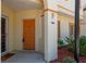Inviting entry with a vibrant door, decorative accents, and manicured landscaping at 1236 Rio De Janeiro Ave # 406, Punta Gorda, FL 33983