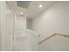 Upstairs hallway featuring white doors, railing, and a light-filled space at 1236 Rio De Janeiro Ave # 406, Punta Gorda, FL 33983