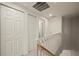 Upstairs hallway with multiple closets and doorways providing ample storage and access at 1236 Rio De Janeiro Ave # 406, Punta Gorda, FL 33983