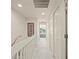Bright upstairs hallway featuring carpet flooring, closet space, and a view to outside at 1236 Rio De Janeiro Ave # 406, Punta Gorda, FL 33983