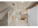 Bright kitchen with tile flooring, white appliances, and seamless access to the dining area at 1236 Rio De Janeiro Ave # 406, Punta Gorda, FL 33983