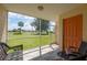 Inviting screened lanai with comfortable seating and scenic views of lush greenery and palm trees at 1236 Rio De Janeiro Ave # 406, Punta Gorda, FL 33983