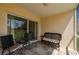 Relaxing screened lanai with comfortable seating, ideal for enjoying outdoor living and views at 1236 Rio De Janeiro Ave # 406, Punta Gorda, FL 33983