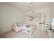 Bright living room with a sofa, table, and dining area, flowing into the kitchen at 1236 Rio De Janeiro Ave # 406, Punta Gorda, FL 33983