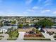 An aerial view of the home showing the landscaping and long driveway at 125 Small Se St, Port Charlotte, FL 33952
