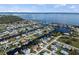 Stunning aerial view of a waterfront community with canals, homes, and a wide expanse of open water at 125 Small Se St, Port Charlotte, FL 33952