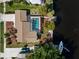 Aerial view of waterfront house, pool, boat dock and boat parked on a canal at 125 Small Se St, Port Charlotte, FL 33952