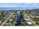 Scenic aerial view of canal-front homes, showcasing waterfront living and community layout at 125 Small Se St, Port Charlotte, FL 33952