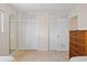Bedroom with mirrored closet, plus an additional closet and a wooden dresser at 125 Small Se St, Port Charlotte, FL 33952