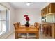 Cozy dining area with a view, complemented by a stylish bar area perfect for entertaining guests at 125 Small Se St, Port Charlotte, FL 33952