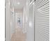 Bright hallway featuring white doors and a peek into another room at 125 Small Se St, Port Charlotte, FL 33952