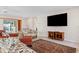 Inviting living room area featuring a modern TV, Terrazzo floors and comfortable furniture at 125 Small Se St, Port Charlotte, FL 33952