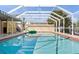 An enclosed pool featuring cool water and plenty of space to swim at 125 Small Se St, Port Charlotte, FL 33952
