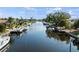 Beautiful view of a calm waterway, lined with boats and well-maintained waterfront properties at 125 Small Se St, Port Charlotte, FL 33952