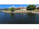 Waterfront home boasting a private dock, lush greenery, and screened in patio at 1318 San Mateo Dr, Punta Gorda, FL 33950
