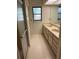 Bathroom with double vanity, tile flooring, and walk-in shower at 1318 San Mateo Dr, Punta Gorda, FL 33950