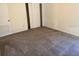 Bedroom with neutral walls and carpet and bi-fold doors at 1318 San Mateo Dr, Punta Gorda, FL 33950