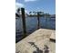 Private dock with a picturesque view of the canal and surrounding waterfront homes at 1318 San Mateo Dr, Punta Gorda, FL 33950