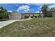 Charming single-story home with a well-maintained lawn and two-car garage at 1318 San Mateo Dr, Punta Gorda, FL 33950