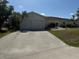 A well-maintained single-story home boasts a spacious driveway and two-car garage at 1318 San Mateo Dr, Punta Gorda, FL 33950