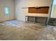 A spacious, unfinished garage awaits your personal touch and customization at 1318 San Mateo Dr, Punta Gorda, FL 33950