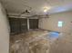 Large two-car garage with concrete floors, dual overhead doors, and ample storage space at 1318 San Mateo Dr, Punta Gorda, FL 33950