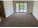 Bright living room with sliding glass doors leading to a outdoor space with water views at 1318 San Mateo Dr, Punta Gorda, FL 33950