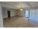 Bright living room with tile floors, a ceiling fan, and sliding glass doors leading to an outdoor patio at 1318 San Mateo Dr, Punta Gorda, FL 33950