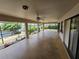 Spacious screened patio featuring ceiling fans, waterfront views, and lush landscaping, ideal for outdoor entertaining at 1318 San Mateo Dr, Punta Gorda, FL 33950