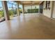 Large screened lanai with ample room for outdoor seating, offering peaceful views of the lush landscaping at 1318 San Mateo Dr, Punta Gorda, FL 33950
