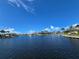 Picturesque waterfront view of canal homes and lush landscaping under a sunny sky at 1318 San Mateo Dr, Punta Gorda, FL 33950