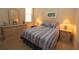Cozy bedroom with a comfortable bed and matching nightstands and a dresser at 13256 Creekside Ln, Port Charlotte, FL 33953