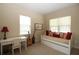 Cozy bedroom features a daybed, desk, and two windows for natural light at 13256 Creekside Ln, Port Charlotte, FL 33953