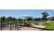 The dog park features shaded seating and tables, offering a relaxing space for owners and their pets at 13256 Creekside Ln, Port Charlotte, FL 33953
