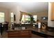 Bright kitchen with stainless steel appliances, granite counters, and view to the living area at 13256 Creekside Ln, Port Charlotte, FL 33953