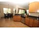 Spacious kitchen with granite countertops and stainless steel appliances, adjacent to dining area at 13256 Creekside Ln, Port Charlotte, FL 33953