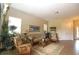 Inviting living room with tile flooring, neutral tones, comfortable seating, and ample natural light at 13256 Creekside Ln, Port Charlotte, FL 33953