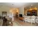 Open-concept living space with tile flooring, bar-style seating, leading to the kitchen and living room at 13256 Creekside Ln, Port Charlotte, FL 33953