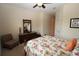 Comfortable main bedroom with tropical bedding and a dark wood dresser at 13256 Creekside Ln, Port Charlotte, FL 33953