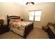 Comfortable bedroom with floral bedding, ceiling fan, and ample natural light at 13256 Creekside Ln, Port Charlotte, FL 33953