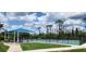 Community pickleball courts with shaded seating, providing a great recreational opportunity for residents at 13256 Creekside Ln, Port Charlotte, FL 33953