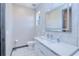 Chic powder room featuring marble tilework, sleek vanity, and modern fixtures providing a spa-like experience at 13295 Eisenhower Dr, Port Charlotte, FL 33953