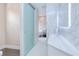 Modern bathroom featuring frosted sliding glass door, toilet, floating vanity and freestanding tub at 13295 Eisenhower Dr, Port Charlotte, FL 33953