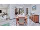 Dining area with a wood table set and view of the outdoor pool area at 13295 Eisenhower Dr, Port Charlotte, FL 33953