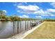 Waterfront property with a dock along the canal, offering serene views and convenient water access at 13295 Eisenhower Dr, Port Charlotte, FL 33953